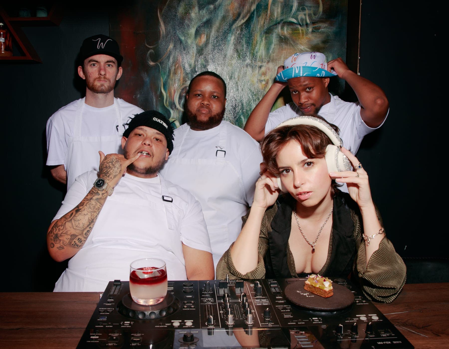Chef Ismail Amos, DJ Meek and the Wiggle Room crew gathered behind the decks